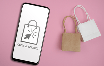 Handy mit Click & Collect Aufschrift und Einkaufstaschen. Copyright: Shutterstock