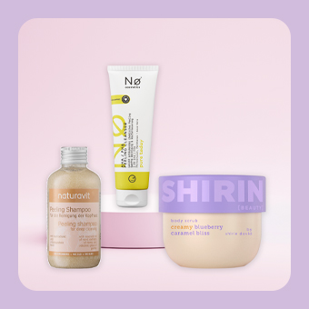 Peeling‑ und Pflegeprodukte für Körper und Haare, darunter Shampoo, Serum und Body Scrub für sanfte Hauterneuerung und Körperpflege