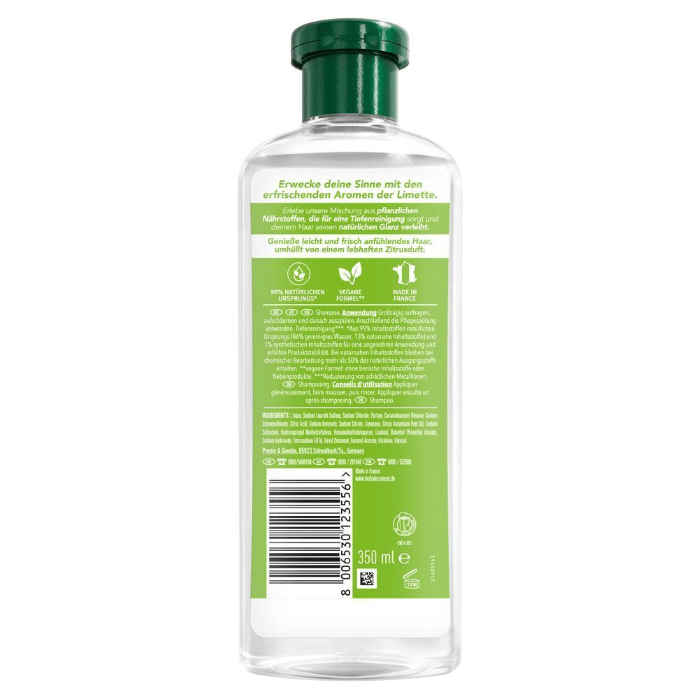Herbal Essences Shampoo-Flasche, rückseitig abgebildet, mit dem Hinweis 99% natürlichen Ursprungs und Vegane Formel.