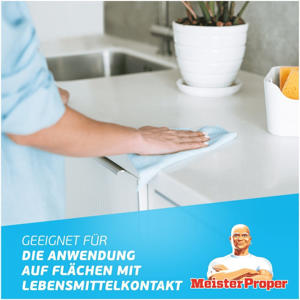 Mr. Proper entfernt Schmutz von einer Küchenarbeitsplatte, geeignet für die Anwendung auf Flächen mit Lebensmittelkontakt.