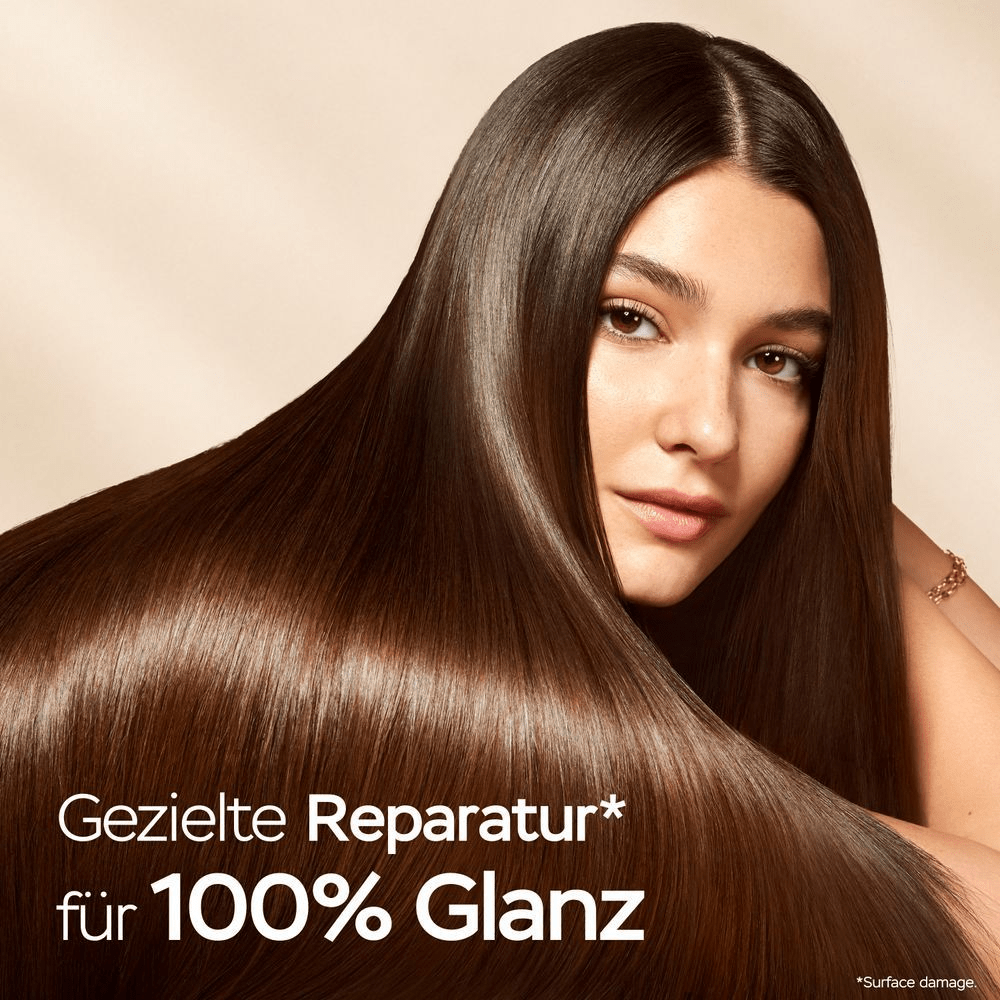 Pantene Pro-V: Frau mit glänzendem Haar und dem Claim Gezielte Reparatur für 100% Glanz.